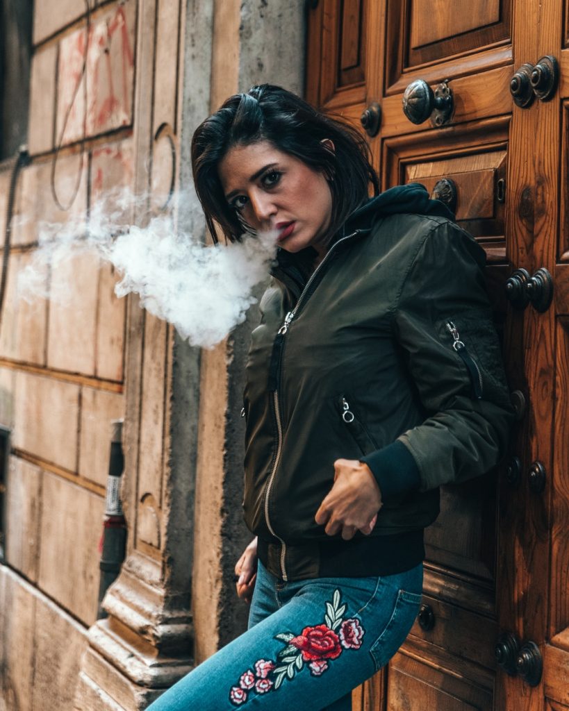 woman smoking cannabis concentrate